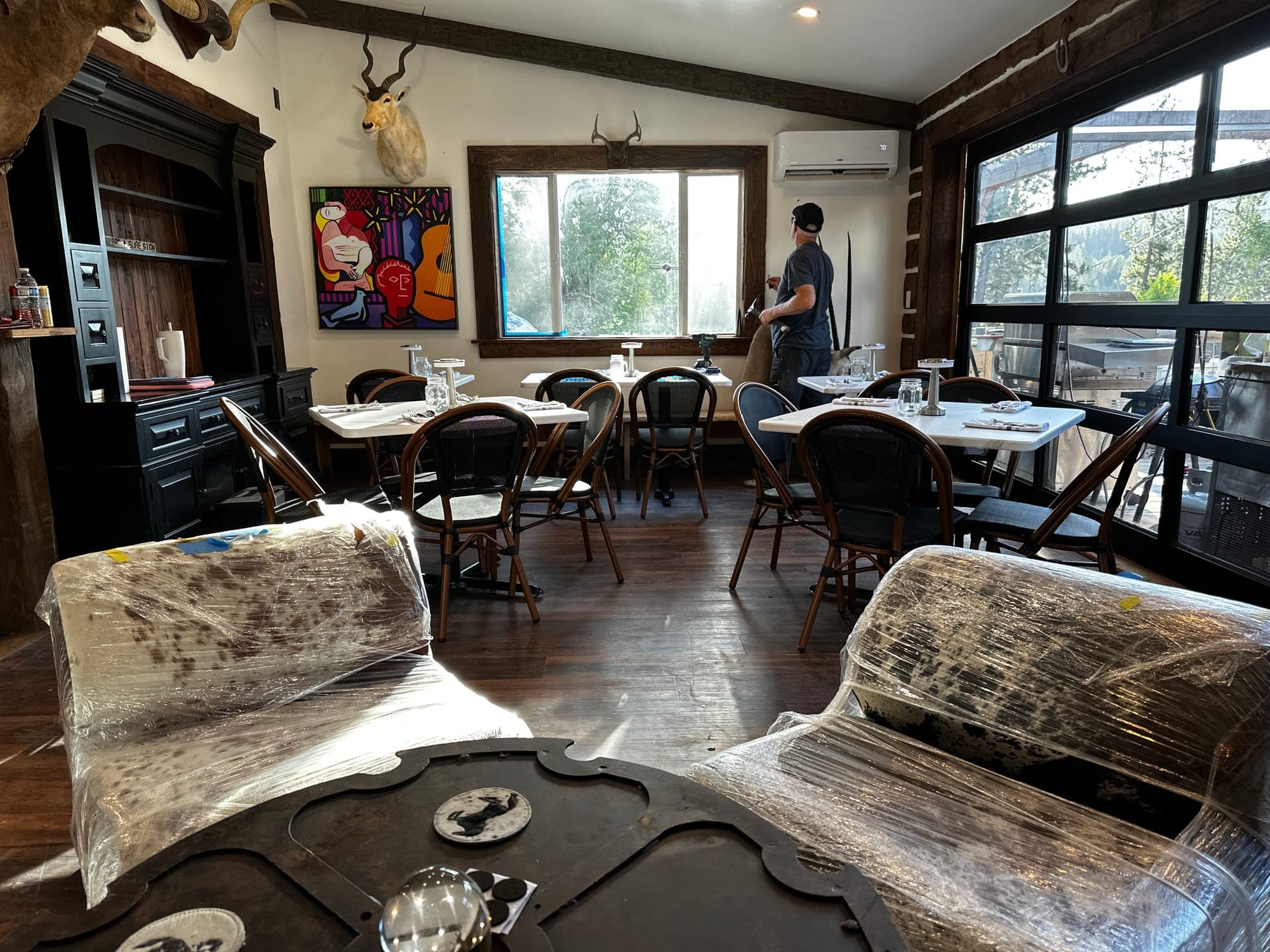 Warm leather lodge couch under a buffalo mount on the Red’s Tavern porch, the reward after a Trail of the Coeur d’Alenes ride