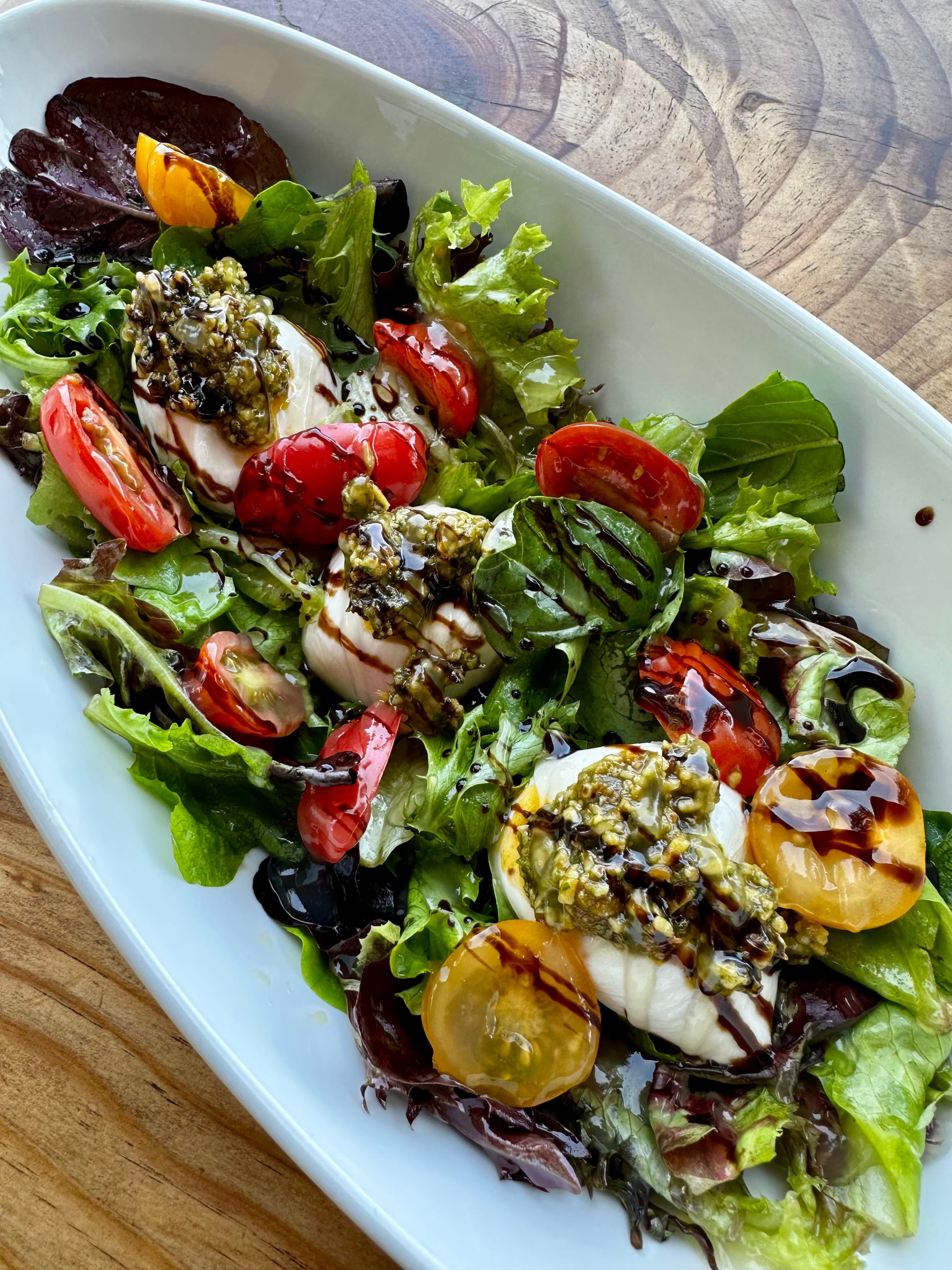 Garden tomatoes and basil on the plate at Red's Tavern